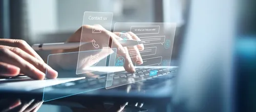Hands using a laptop with a floating digital contact interface, representing unlimited fixed-fee IT support